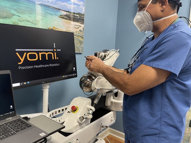 Dr. Arauz shows The Daily News parts of the robot and how it works.